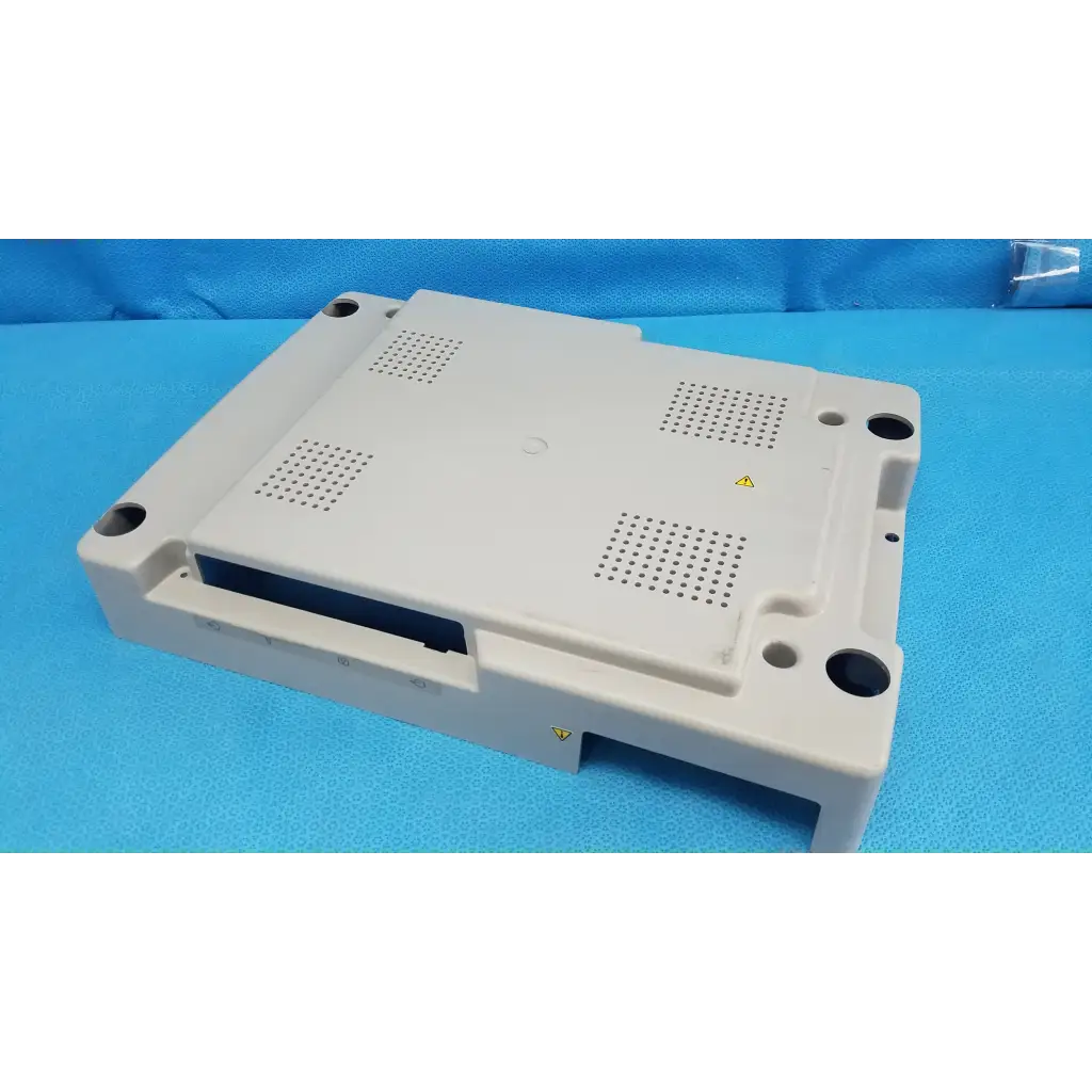 Beige plastic base shroud plastic cover panel with ventilation and mounting holes for trc-nw6s retinal camera