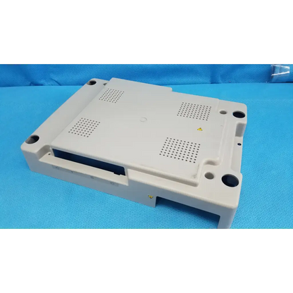 Beige plastic base shroud plastic cover panel with ventilation and mounting holes for trc-nw6s retinal camera