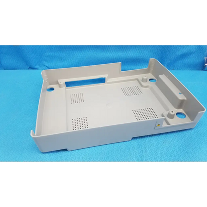 Beige base shroud plastic cover panel with perforated sections and mounting holes for trc-nw6s retinal camera