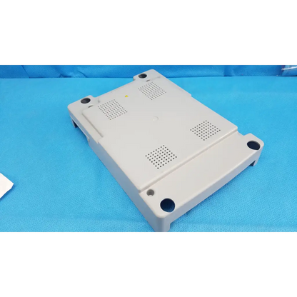 Beige base shroud plastic cover panel with ventilation and mounting holes for topcon trc-nw6s retinal camera back side