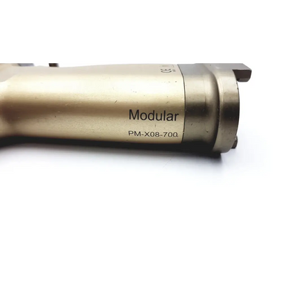 Gold-colored metallic modular orthopedic tool engraved with brasseler modular pm-x08-700 model number