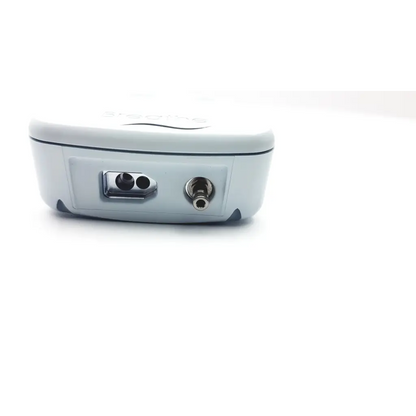 White plastic niov patient interface device showing back side with two ports for patient connectivity and use
