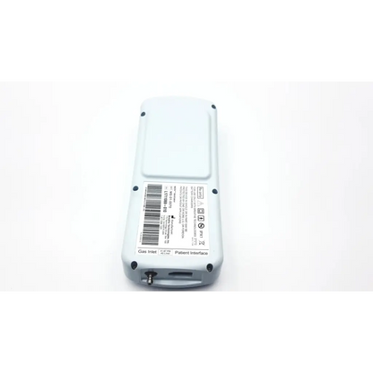 Light gray niov patient interface with rectangular body rounded edges and labeled ports for gas inlet and patient connection