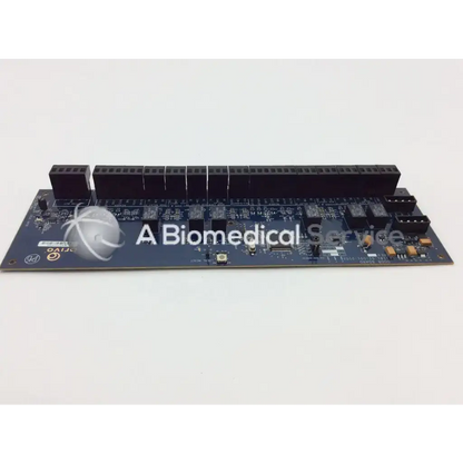 Dark blue rectangular brivo 1181-01-001-0102 door slave board with black connectors and electronic components