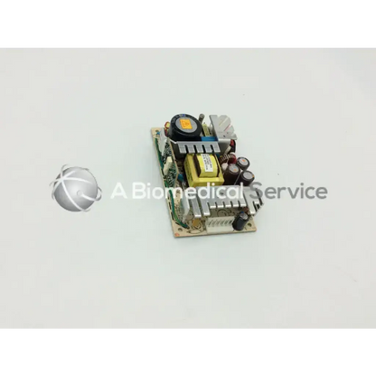 A compact beige brocade 300 transformer 5117312-0a00 rev power supply unit with green circuit board and electronic components