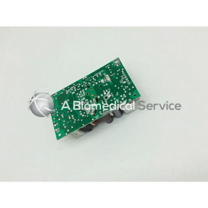 Green rectangular brocade 300 transformer 5117312-0a00 rev circuit board with silver spherical component and electronic parts