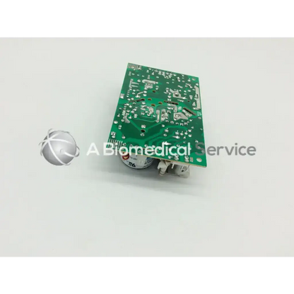 Green rectangular brocade 300 transformer 5117312-0a00 rev circuit board with silver solder points and white components
