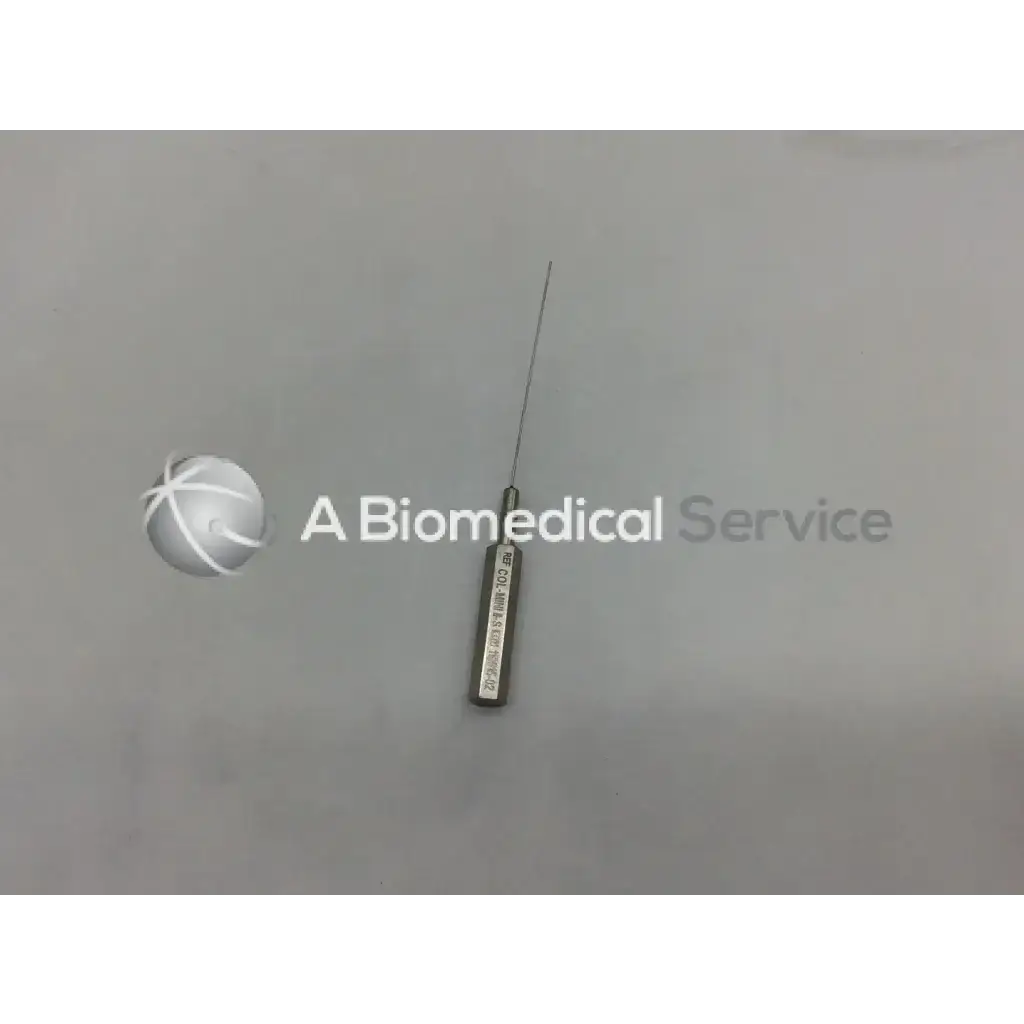 A metallic byron col-mini ii-s infiltration cannula style needle with a slender pointed tip and engraved cylindrical handle