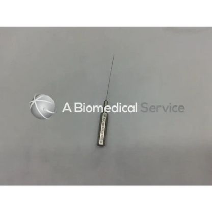 A metallic byron col-mini ii-s infiltration cannula style needle with a slender pointed tip and engraved cylindrical handle