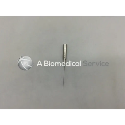 A metallic infiltration cannula style needle with a slender straight shaft and cylindrical hub for medical use