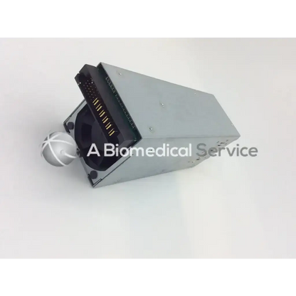 Silver metallic dell 570w rps power supply unit with black connector and white crosshatch spherical component