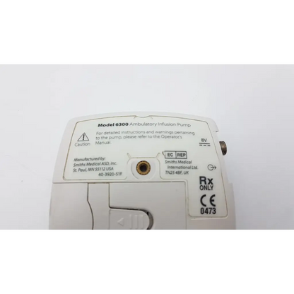 White plastic cadd-legacy 6300 pump ac5-376 ambulatory infusion pump with labels and regulatory markings