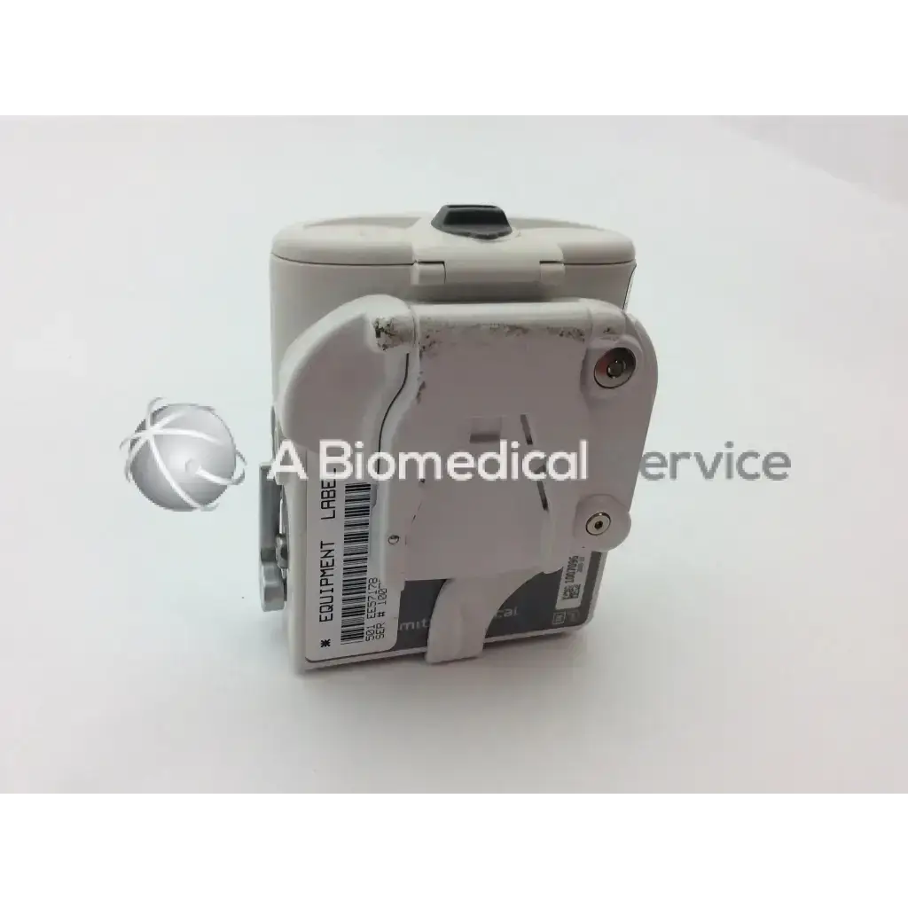 Gray plastic cadd solis vip 2120 infusion pump with hinged lid and attached label for medical use