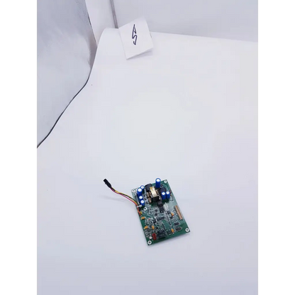 Green printed circuit board with blue capacitors and multicolored wire connector for camino neurocare power board ps output
