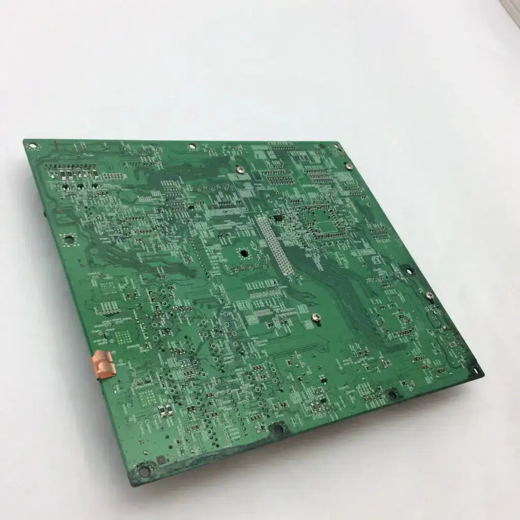 Green rectangular canon image prograf ipf-5000 main board with intricate silver traces and component mounting holes