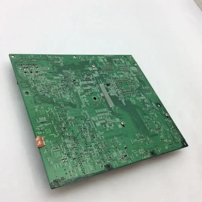 Green rectangular canon image prograf ipf-5000 main board with intricate silver traces and component mounting holes