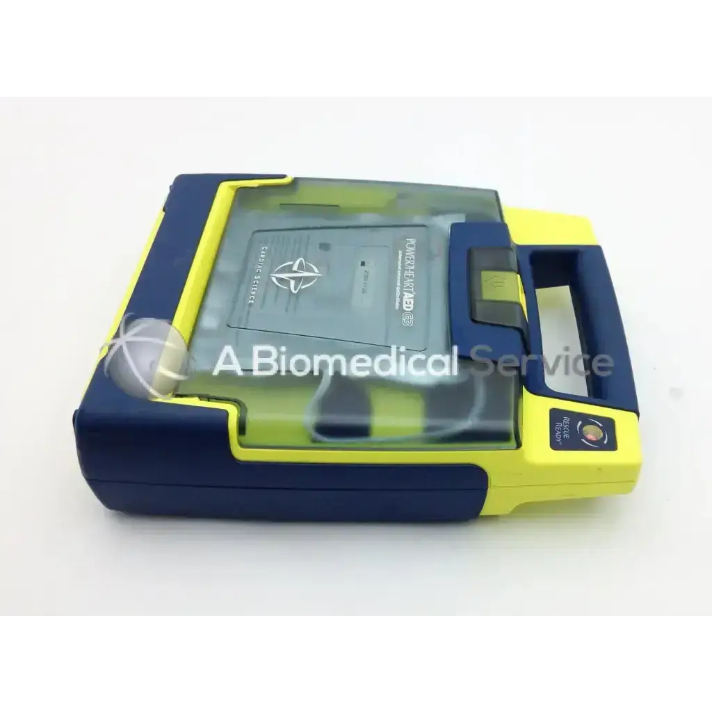 Blue and yellow cardiac science aed power heart g3 with transparent lid showing internal components and carry case