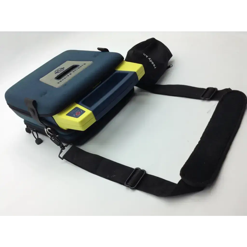 Blue and yellow cardiac science aed trainer portable medical device case with black adjustable shoulder strap and pads