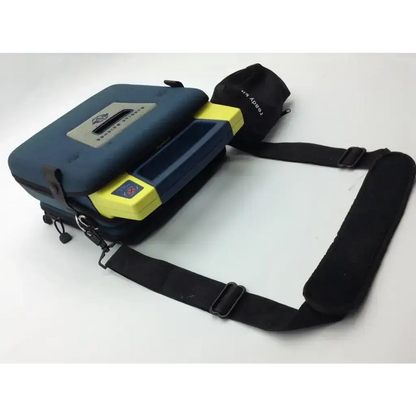 Blue and yellow cardiac science aed trainer portable medical device case with black adjustable shoulder strap and pads