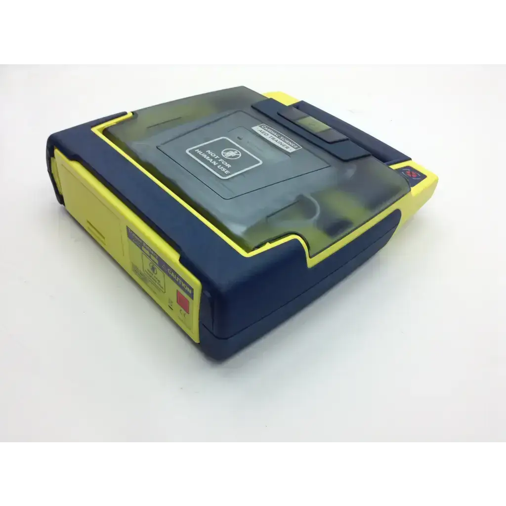 Blue and yellow cardiac science aed trainer with transparent lid includes pads and case for emergency training use