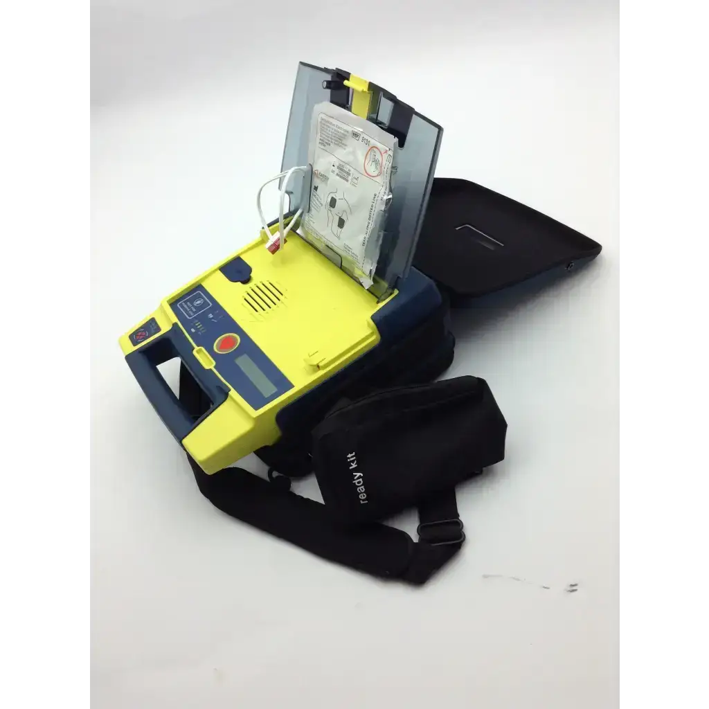 Yellow and blue cardiac science aed trainer with digital display control buttons and attached cables for training use