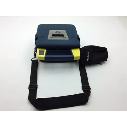 Blue and yellow cardiac science aed trainer with black carrying strap pads and case for emergency response training