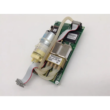 Green circuit board assembly with integrated pump and tubing featuring labeled components by cas medical systems
