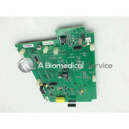 Green printed circuit board with electronic components and silver sphere on left side in casmed 03090235r00 board