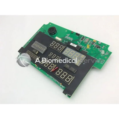 Green circuit board with black digital display panels and electronic components in casmed 03090235r00 board product