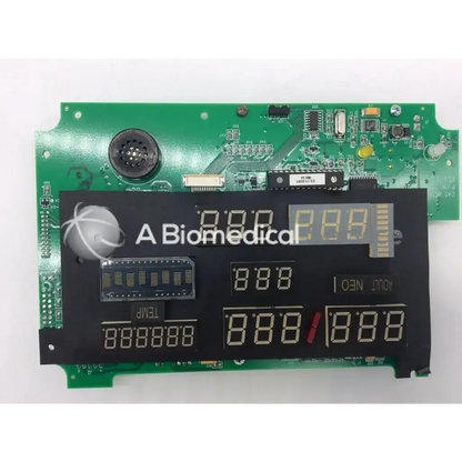 Black digital display panel with yellow led digits mounted on green circuit board of casmed 03090235r00 board