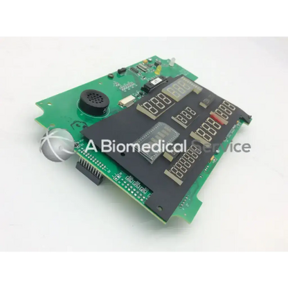 Green circuit board with black digital display panels and circular speaker component of casmed 03090235r00 board