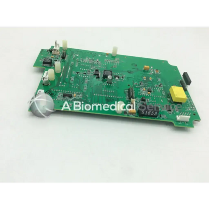 Green printed circuit board with various electronic components and yellow connector casmed 03090235r00 board