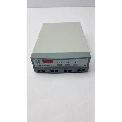Gray rectangular c.b.s. scientific eps-300 iiv 300v electrophoresis power supply with red digital display and multiple input ports