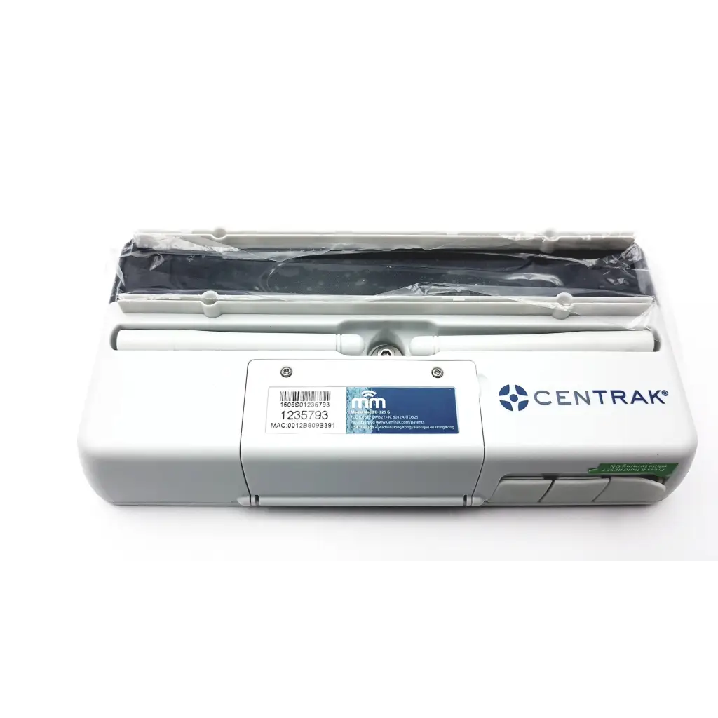White plastic centrak mm vw monitor itdk-325 g device with black component wrapped in clear film on top ab3-7 2923sm