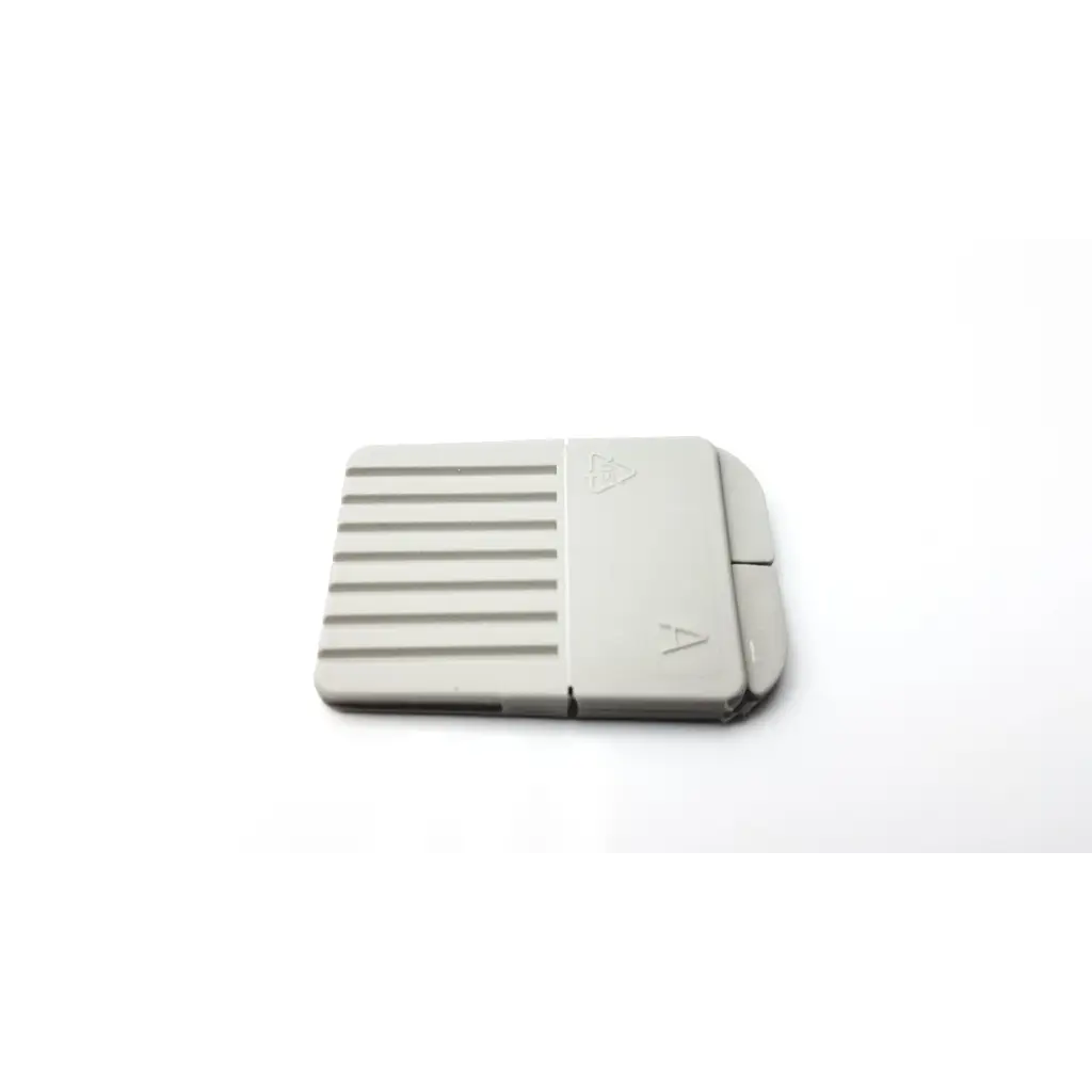 Gray plastic cerustop wax guards card reader with textured surface and directional arrows on the cover