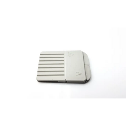 Gray plastic cerustop wax guards card reader with textured surface and directional arrows on the cover