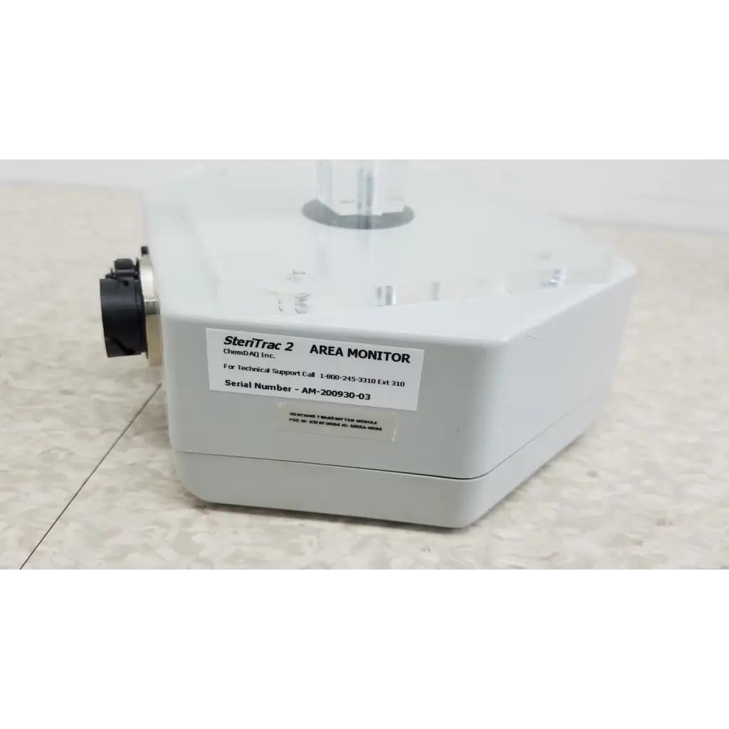 Chemdaq steri-trac 2 fixed gas monitor system with white body, black cylindrical attachment, and clear plastic top component