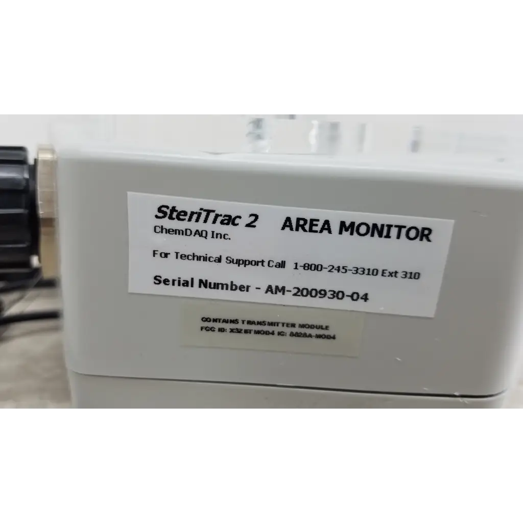 White rectangular chemdaq steri-trac 2 peracetic acid monitor with acrylic stand and cable for safety monitoring