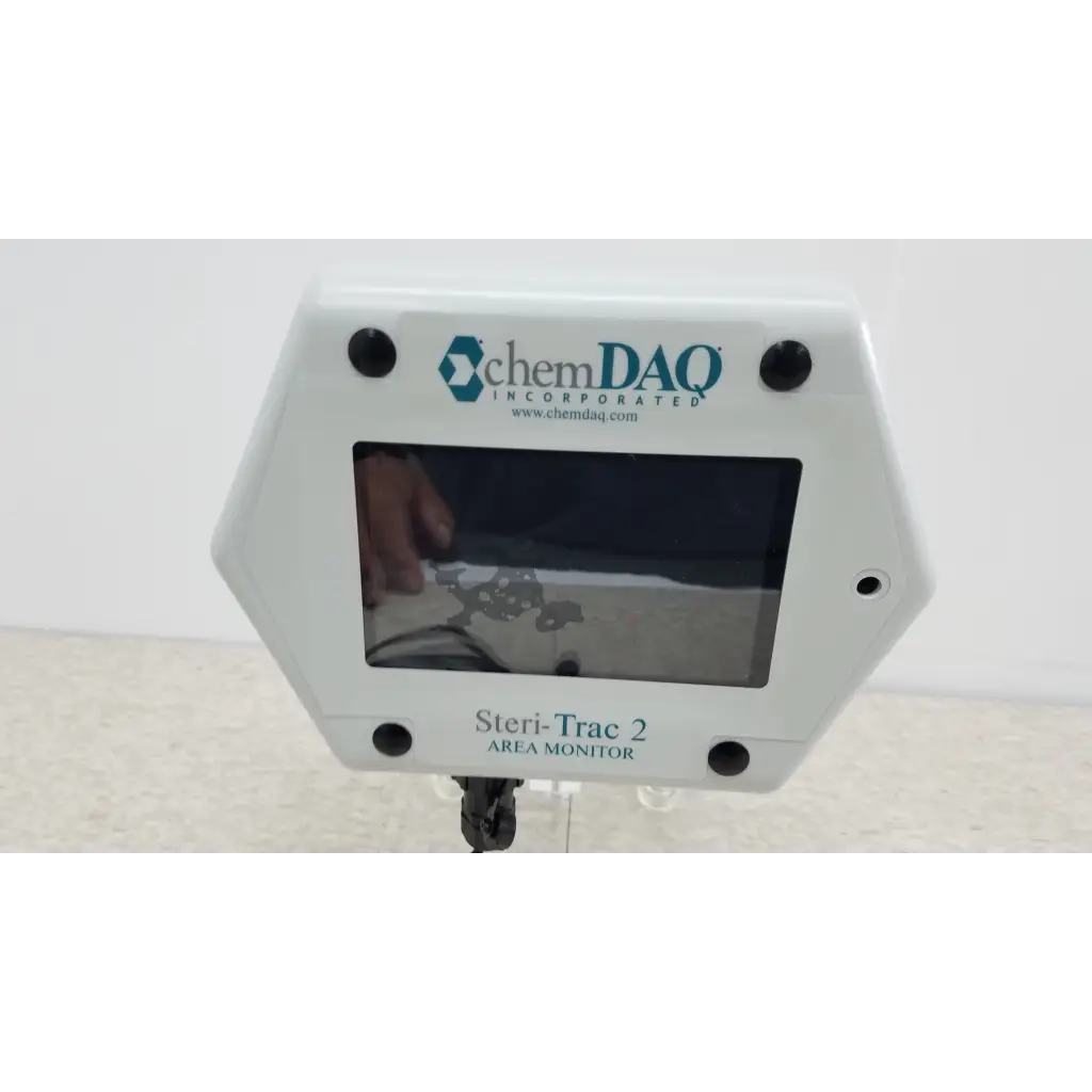 White hexagonal chemdaq steri-trac 2 peracetic acid monitor with digital display acrylic stand and black mounting screws