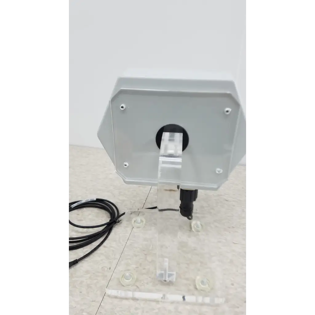 Gray octagonal chemdaq steri-trac 2 peracetic acid monitor with black port and clear acrylic stand for safe chemical tracking
