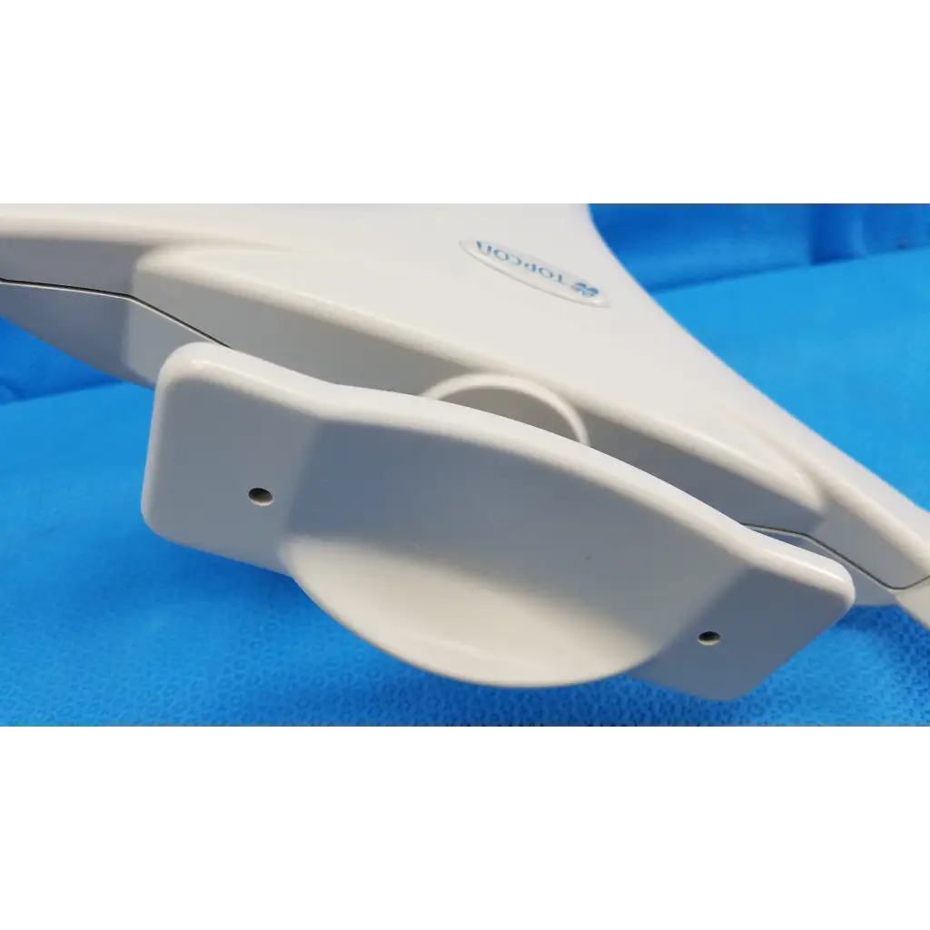 White plastic chin rest assembly frame with curved handle and two small holes for topcon trc-nw8 retinal camera