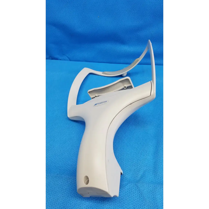 White plastic barcode scanner with ergonomic grip and curved handle for chin rest assembly frame use
