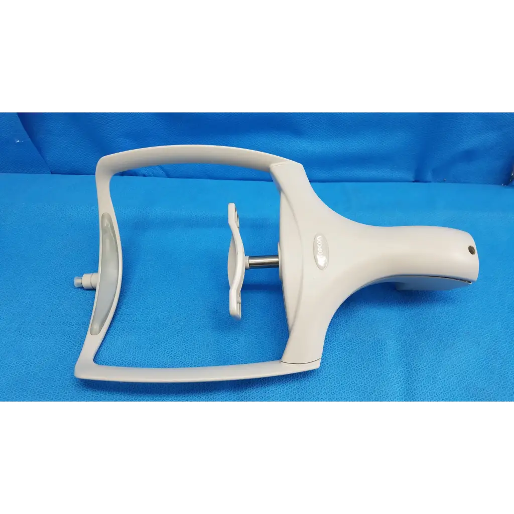 White plastic dental handpiece with curved handle and metallic shaft part of chin rest assembly for topcon trc-nw8 retinal camera