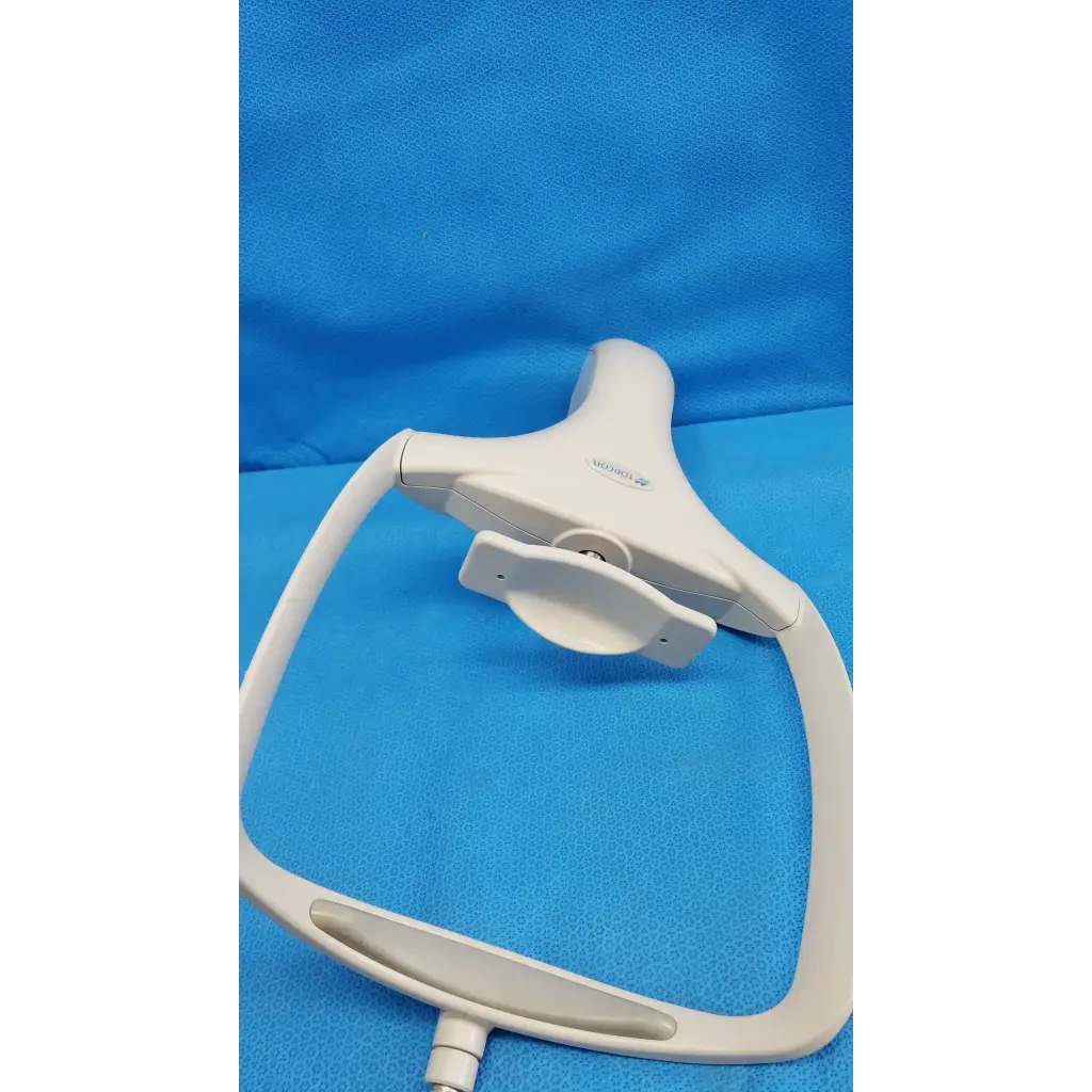 White plastic dental handpiece with curved handle and adjustable head shown with chin rest assembly frame for topcon trc-nw8 retinal camera