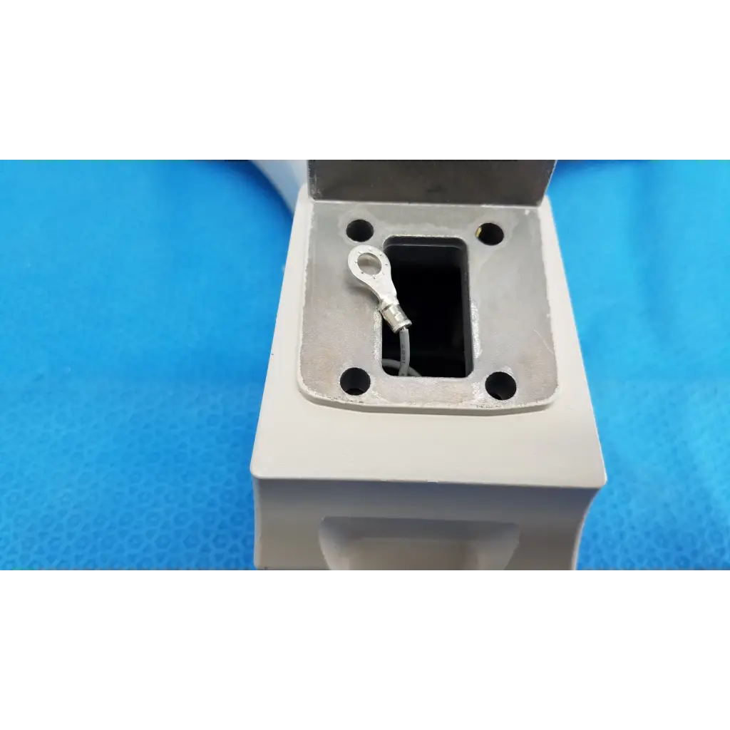 White rectangular metal chin rest assembly frame with square opening and wire terminal for topcon trc-nw8 retinal camera