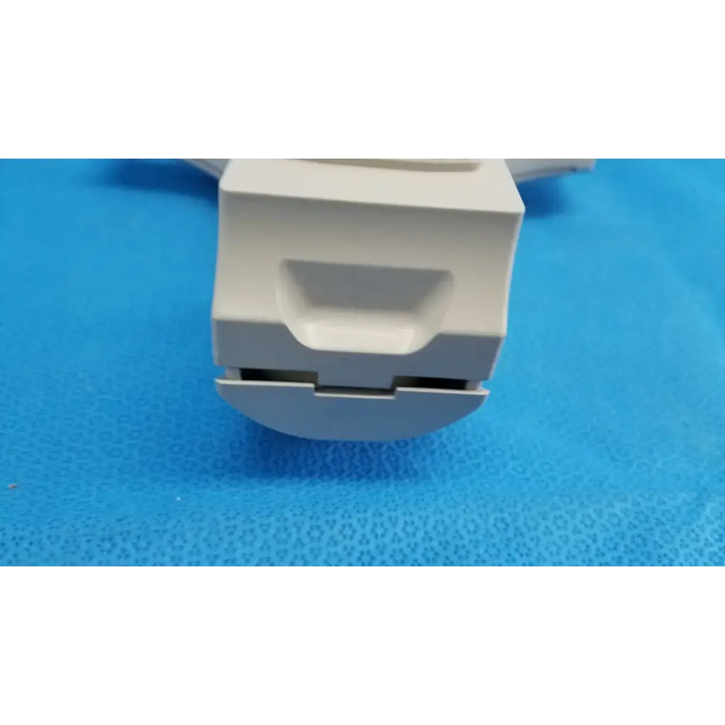 White plastic drawer pull with rectangular handle and integrated slot for chin rest assembly in topcon trc-nw8 retinal camera