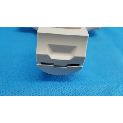 White plastic drawer pull with rectangular handle and integrated slot for chin rest assembly in topcon trc-nw8 retinal camera