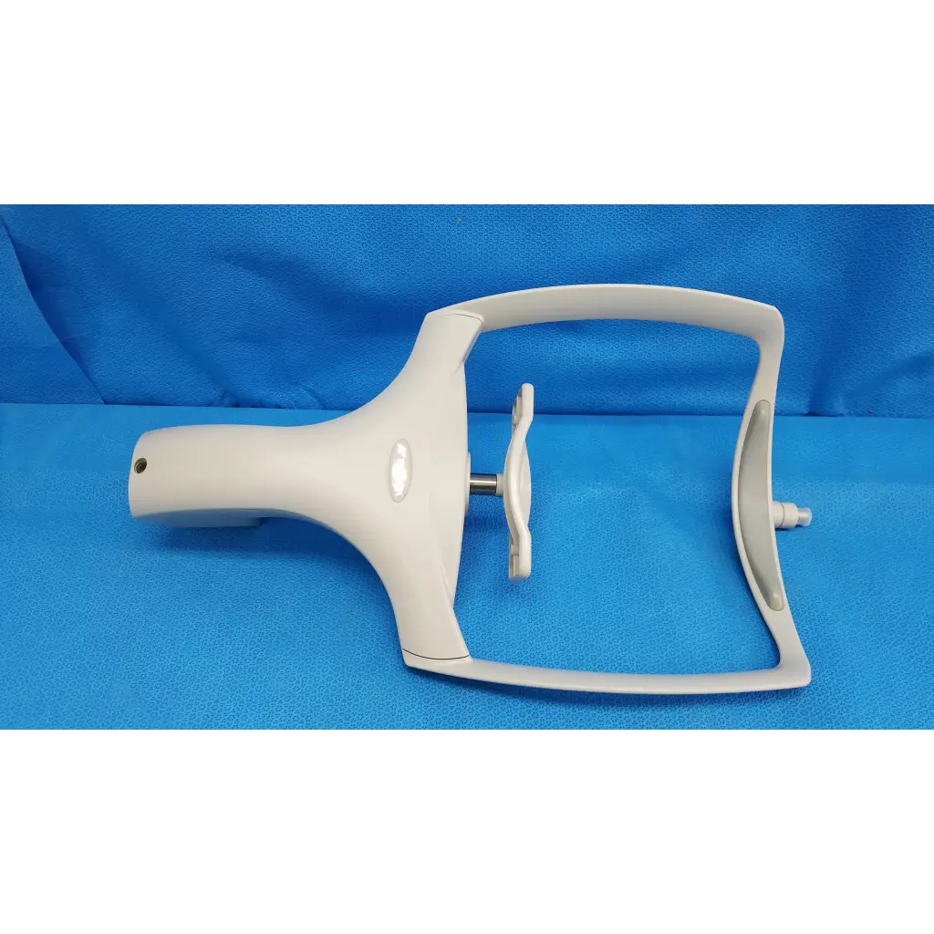White plastic medical speculum with handle and adjustable mechanism for chin rest assembly in topcon trc-nw8 retinal camera