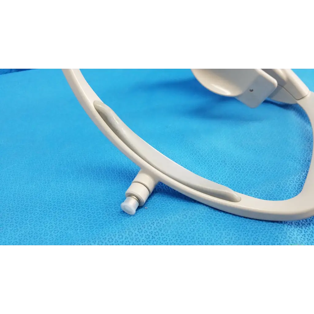 White plastic chin rest assembly frame with curved ergonomic headband and adjustable strap for topcon trc-nw8 retinal camera