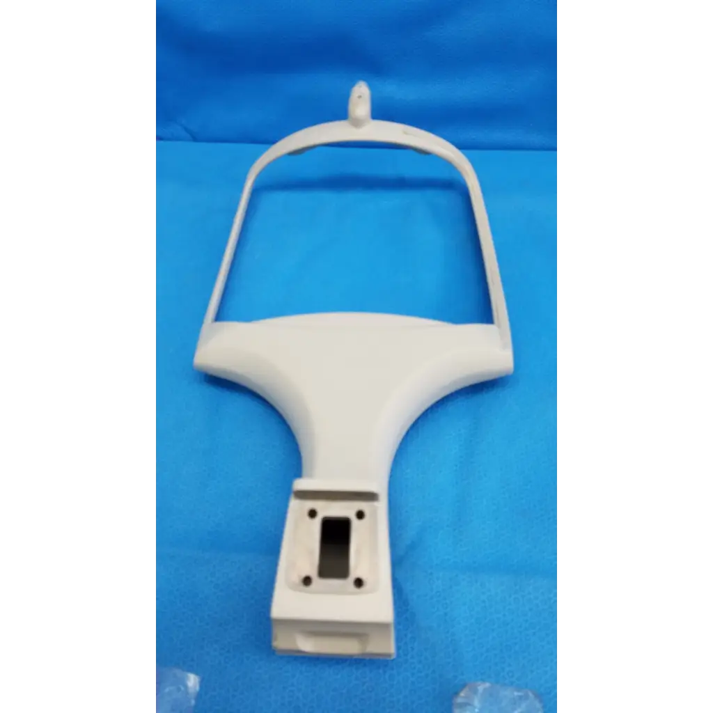 White plastic mounting bracket with curved top and four screw holes for trc-nw6s chin rest forehead assembly frame